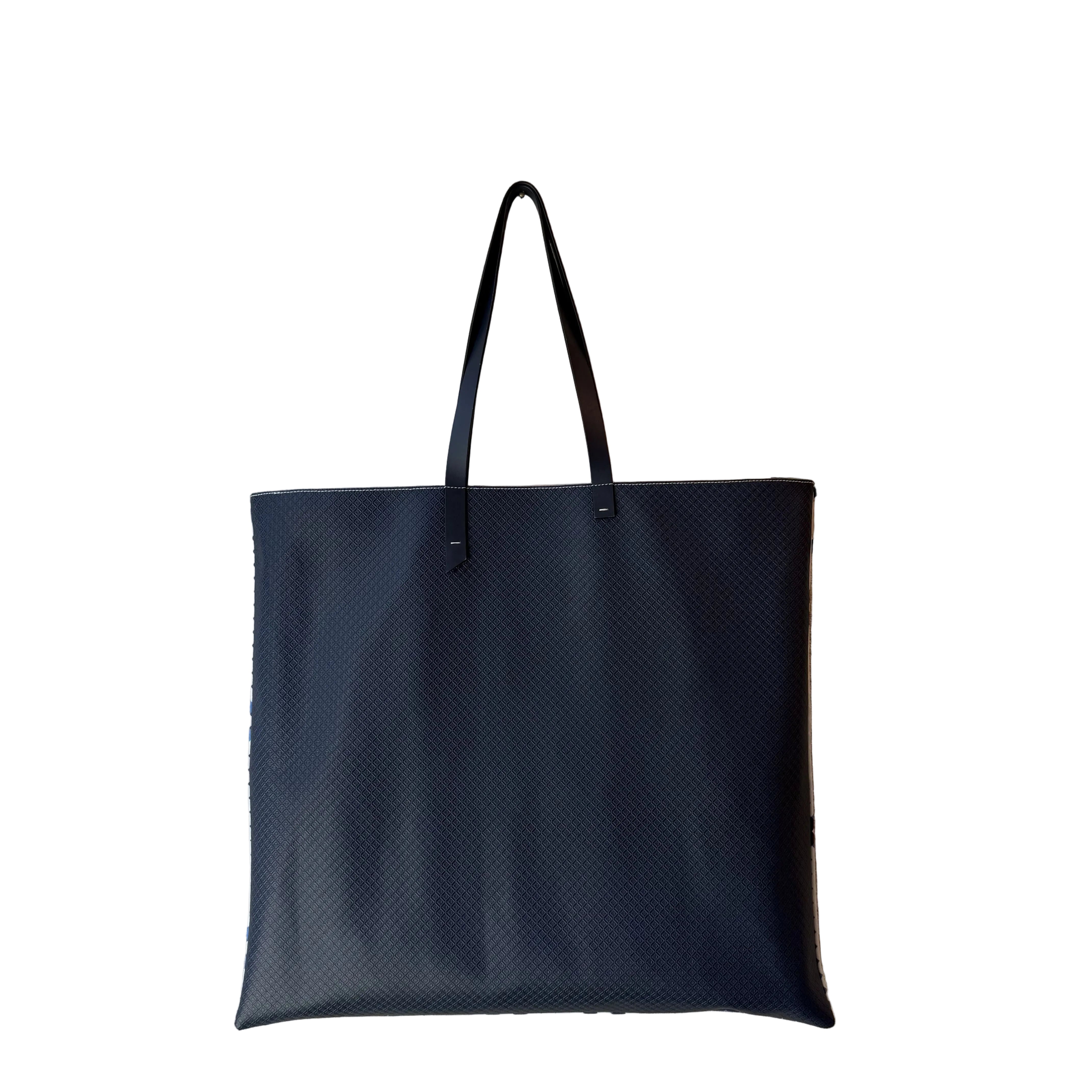 MARK / GIUSTI Signature CALA Oversized tote bag converted to square shape in leather with embossed mosaic leather on the reverse featuring a solid Navy front pocket and handles.