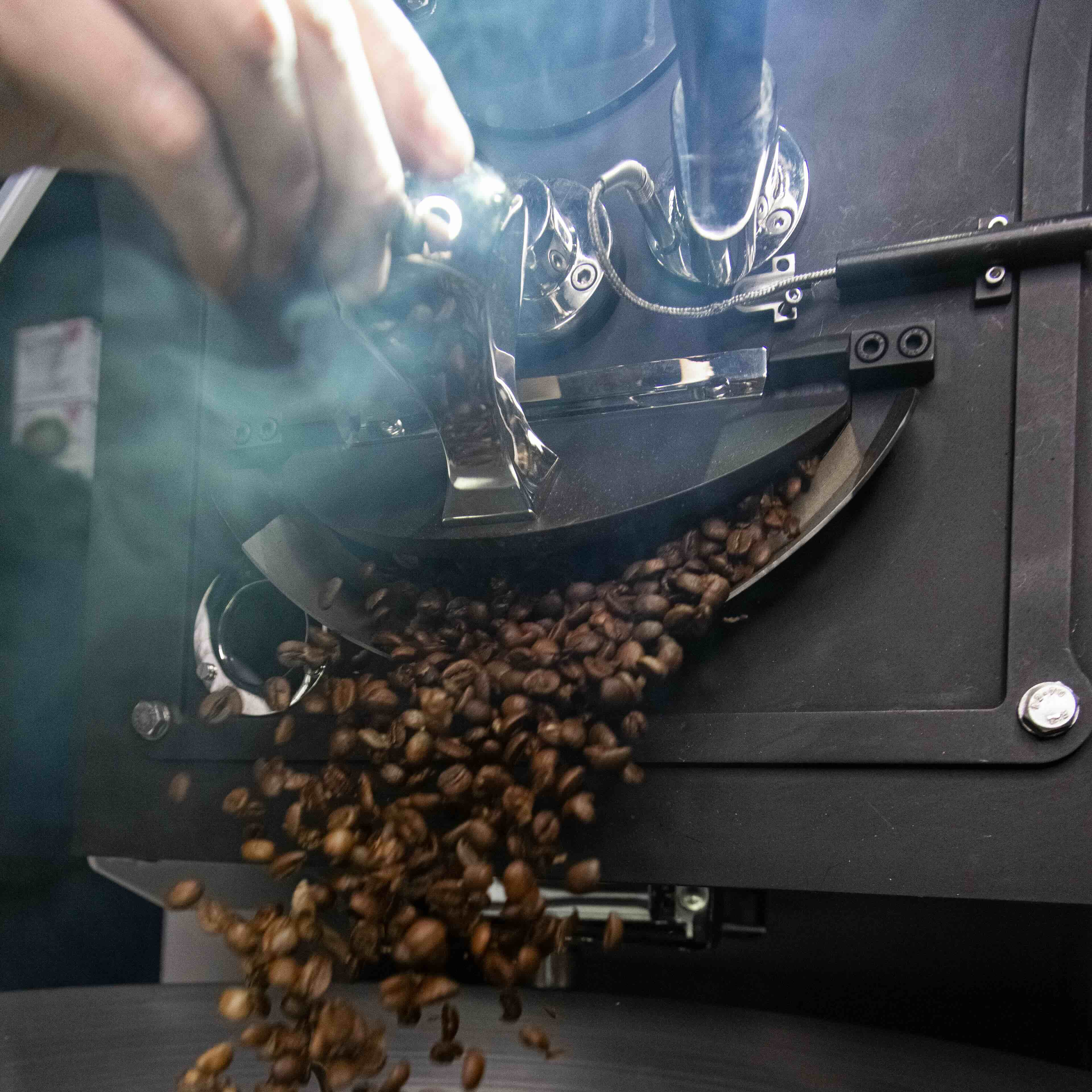 Coffee beans being roasted in a machine, demonstrating Cafézal’s sensory journey experience at the MARK / GIUSTI Experiential Pop-Up.