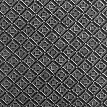 Close-up of MARK / GIUSTI’s signature mosaic embossed leather, showcasing the intricate craftsmanship and attention to detail in creating a unique texture that represents the brand’s dedication to quality and artistry.