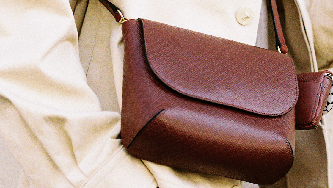 MARK / GIUSTI Italian leather crossbody bellagio bag worn on body in Port Red with signature mosaic leather.