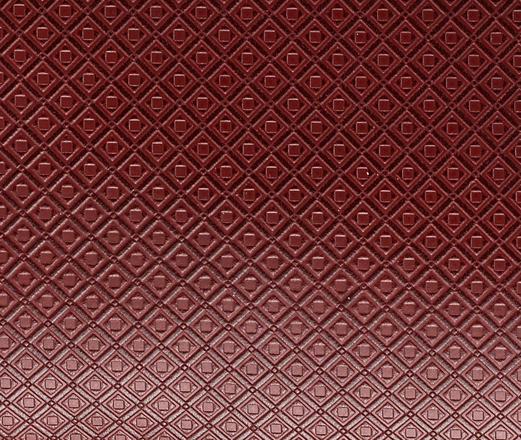 Close-up of MARK/GIUSTI’s signature embossed mosaic leather, reflecting the textured layers inspired by historic Cosmati designs. This custom-developed leather captures the tactile essence of geometric mosaic patterns, combining artistry with modern craftsmanship